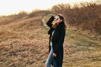 Young woman standing on land