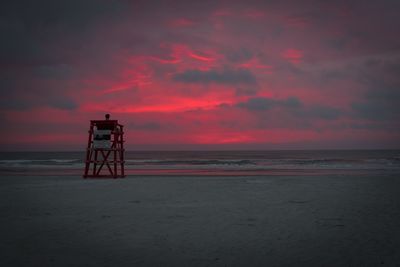 Scenic view of beach against sky during sunset