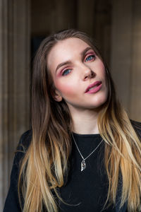 Portrait of smiling woman with long hair