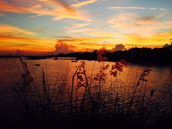 Scenic view of lake against sky during sunset