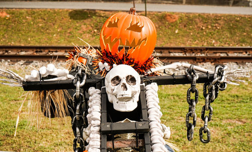 Close-up of pumpkin on stone wall during halloween