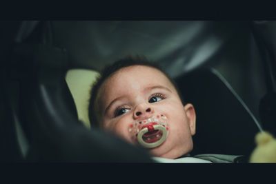 Portrait of cute boy eating food