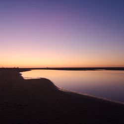 Scenic view of sea against clear sky during sunset