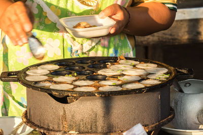 Close-up of person preparing food