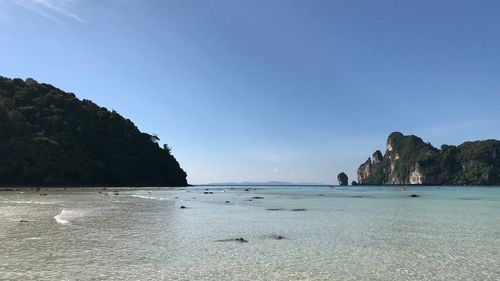 Scenic view of sea against clear blue sky