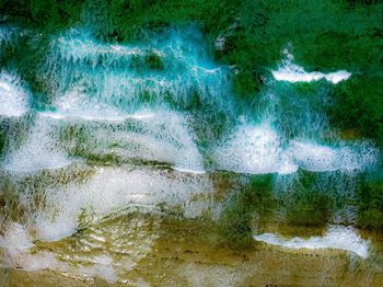 Full frame shot of water flowing through rocks