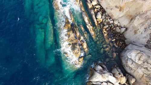 High angle view of rock formation in sea