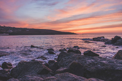 Scenic view of sea against dramatic sky