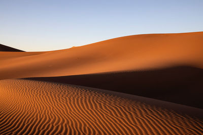 Scenic view of desert against clear sky