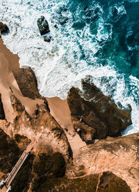 High angle view of rock formation in sea