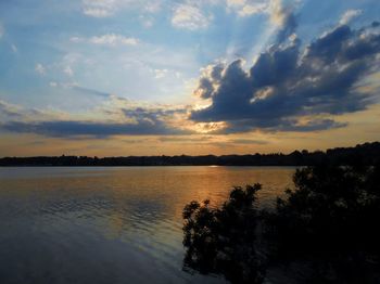 Scenic view of lake against sky during sunset