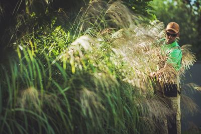 Man standing by plants