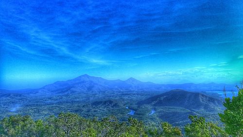 Scenic view of landscape against sky at night