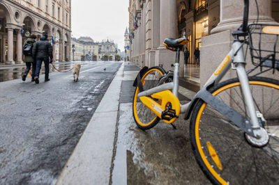 Rear view of man cycling on street