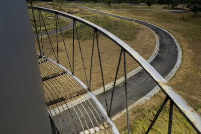 High angle view of railing by bridge