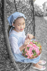 Portrait of smiling girl holding snow