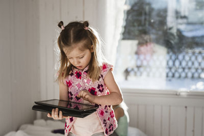 Girl using digital tablet