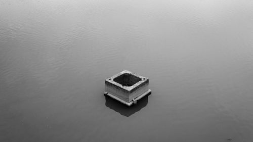 High angle view of metallic structure amidst lake