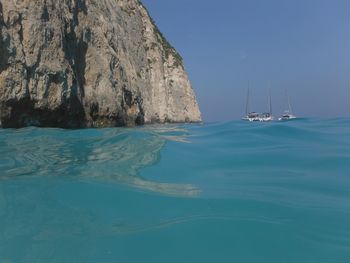 Scenic view of sea against clear blue sky