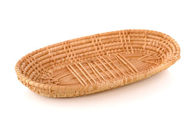 High angle view of wicker basket on white background