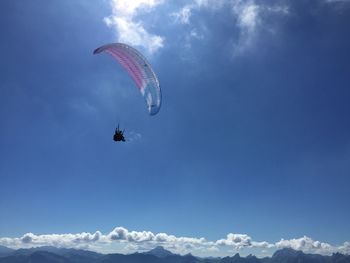 Low angle view of person paragliding