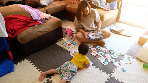 High angle view of people sitting on floor