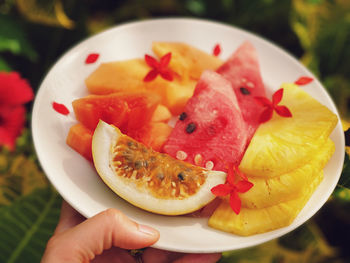 Fresh exotic fruits on plate 