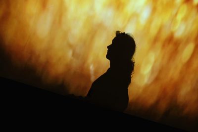 Silhouette of man against sunset sky