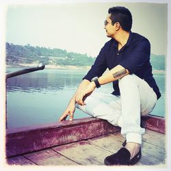 Side view of young man looking away