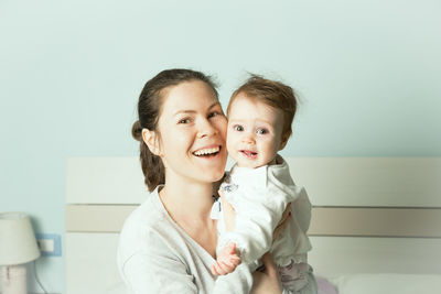 Portrait of happy mother and daughter