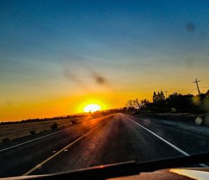 Road against sky during sunset