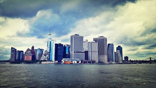 City skyline against cloudy sky