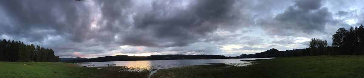 Panoramic view of sea against storm clouds