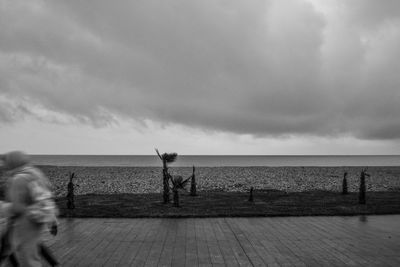 Scenic view of sea against cloudy sky