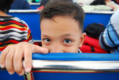 Close-up portrait of boy eyes indoors