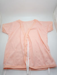 Close-up of clothes hanging against white background