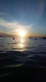 Scenic view of sea against sunset sky