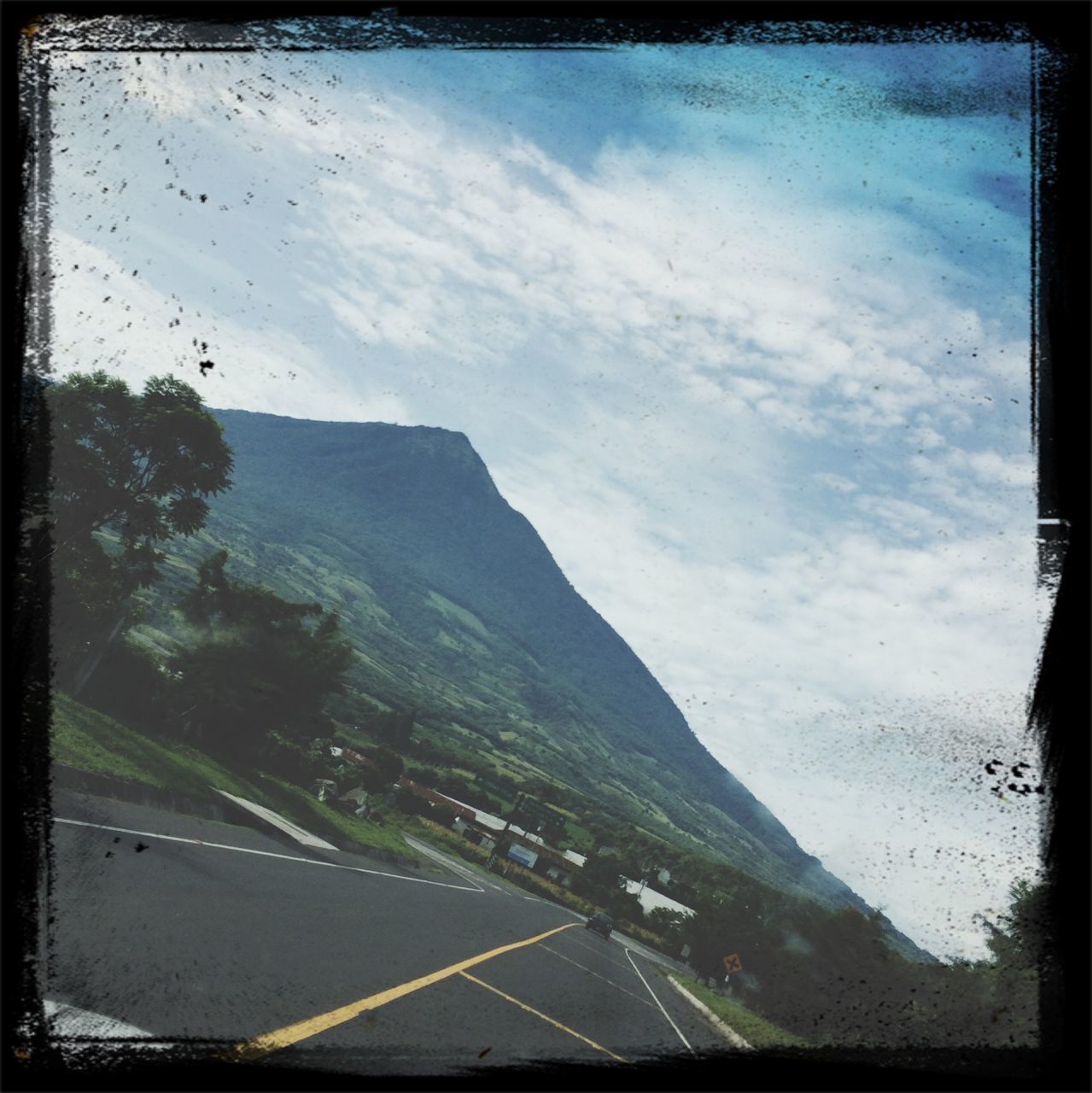 transfer print, auto post production filter, sky, transportation, mountain, landscape, road, high angle view, cloud - sky, car, aerial view, scenics, nature, cloud, land vehicle, day, beauty in nature, outdoors, mode of transport, no people