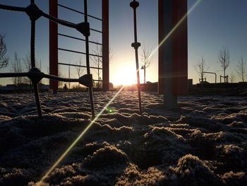 Sun shining over snow covered land