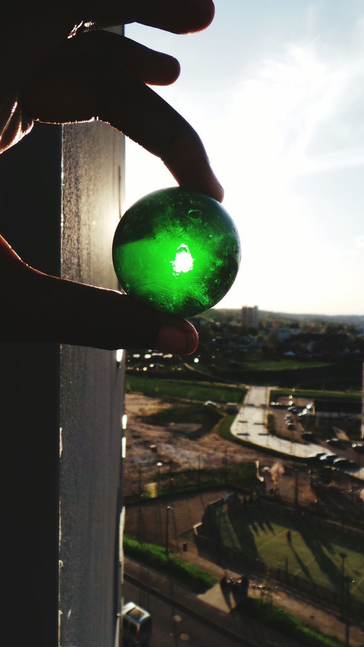 green color, sport, illuminated, multi colored, hanging, sphere, ball, balloon, sky, lighting equipment, tree, outdoors, night, celebration, no people, low angle view, close-up, mid-air, circle, decoration