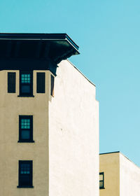 Low angle view of built structure against clear blue sky