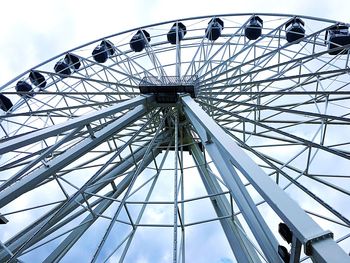 Low angle view of ferris wheel against sky