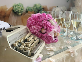 Close-up of pink roses on table