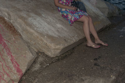 Low section of woman sitting on floor