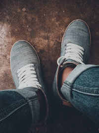 Low section of man standing on floor