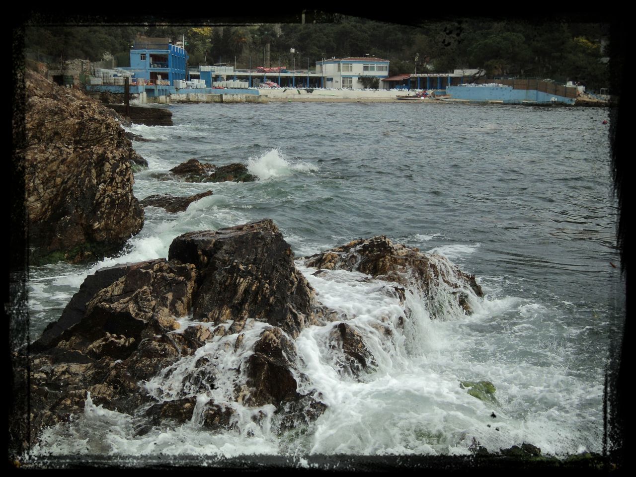 water, sea, waterfront, surf, building exterior, built structure, transfer print, architecture, wave, motion, rock - object, rippled, nature, river, auto post production filter, beauty in nature, flowing water, scenics, day, splashing