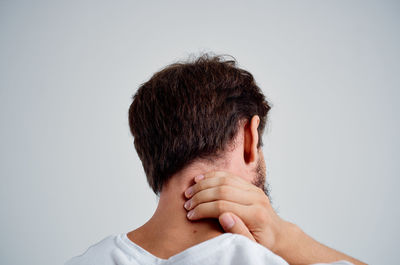 Close-up of man hand against white background