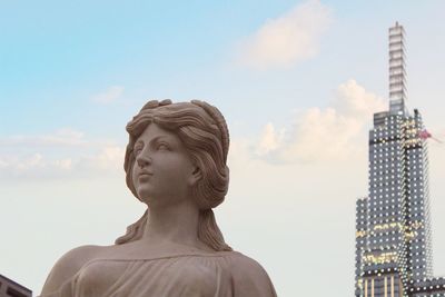 Statue of buildings against sky