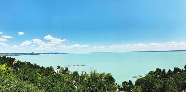 Scenic view of sea against blue sky