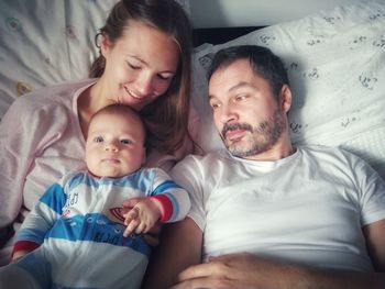 Father and daughter baby on bed